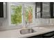 Close up of the kitchen sink and countertop, with a view from the window at 642 Harbor Creek Pl # 21, Charleston, SC 29412