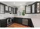 Kitchen featuring stainless steel appliances, dark cabinets, subway tile, and hardwood flooring at 642 Harbor Creek Pl # 21, Charleston, SC 29412