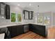 Kitchen featuring stainless steel appliances, dark cabinets, subway tile, and a window view at 642 Harbor Creek Pl # 21, Charleston, SC 29412
