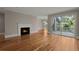 Spacious living room featuring hardwood floors, fireplace, and sliding glass doors to a screened-in porch at 642 Harbor Creek Pl # 21, Charleston, SC 29412