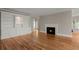 Bright living room with hardwood floors, fireplace, and custom built-in shelving for storage at 642 Harbor Creek Pl # 21, Charleston, SC 29412