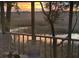 Charming porch view of a golden sunset over the tranquil marshlands and a picturesque tree at 642 Harbor Creek Pl # 21, Charleston, SC 29412