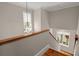 Bright staircase with views of the outdoors from the second-story landing at 642 Harbor Creek Pl # 21, Charleston, SC 29412