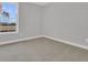 Bright, carpeted bedroom featuring a view of the community from the window at 701 Maynard Ln, Summerville, SC 29486