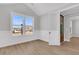 Bright living room with classic wainscoting, neutral walls, and wood-look flooring at 701 Maynard Ln, Summerville, SC 29486