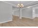 Spacious living room with light wood floors, neutral paint, and modern lighting at 701 Maynard Ln, Summerville, SC 29486