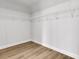 Spacious walk-in closet with custom shelving and wood floors, offering ample storage space at 701 Maynard Ln, Summerville, SC 29486