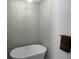 Modern bathroom featuring a standalone tub, new lighting, and gray walls at 732 Gahagan Rd, Summerville, SC 29485