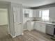 Well-lit kitchen features granite countertops, stainless appliances, and ample storage at 732 Gahagan Rd, Summerville, SC 29485