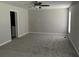Bright living room features a ceiling fan and soft carpet at 732 Gahagan Rd, Summerville, SC 29485