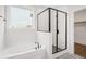 Bright bathroom featuring a modern tub, a glass-enclosed shower, and elegant tile work, creating a spa-like experience at 739 Maynard Ln, Summerville, SC 29486