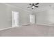 Expansive bedroom featuring plush carpeting, neutral walls, and doorways leading to an ensuite bath and closet areas at 739 Maynard Ln, Summerville, SC 29486