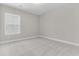 Bright, empty bedroom with neutral walls, carpet flooring, and a large window at 739 Maynard Ln, Summerville, SC 29486