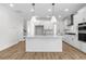 Contemporary kitchen with an expansive central island, modern appliances, and ample cabinetry, perfect for culinary enthusiasts at 739 Maynard Ln, Summerville, SC 29486