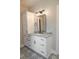 Bathroom featuring modern vanity with granite countertop, dark fixtures, and decorative tile flooring at 74 Longleaf Dr, Walterboro, SC 29488