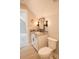 Charming bathroom with white vanity, granite counters, and black hardware at 74 Longleaf Dr, Walterboro, SC 29488