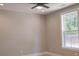 Bedroom with ceiling fan and view of backyard at 74 Longleaf Dr, Walterboro, SC 29488