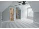 Bright, airy bedroom with carpet, ceiling fan, neutral walls, and an ensuite bathroom with glass shower at 74 Longleaf Dr, Walterboro, SC 29488