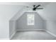 Large, carpeted bedroom with a window and neutral-colored walls, creating a serene and comfortable living space at 74 Longleaf Dr, Walterboro, SC 29488
