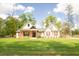 Charming single-story home with a beautifully landscaped front yard and inviting front porch with craftsman style columns at 74 Longleaf Dr, Walterboro, SC 29488