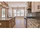 Spacious kitchen with granite counter tops and view to outdoor area at 74 Longleaf Dr, Walterboro, SC 29488