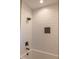 Modern shower with white subway tile, a rainfall shower head, and a contrasting dark-colored built-in niche at 74 Longleaf Dr, Walterboro, SC 29488