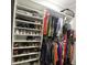 Organized walk-in closet with shelving for shoes and hanging rods for clothes at 7406 Purser Ln, Hanahan, SC 29410