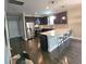 Modern kitchen with granite countertops, stainless steel appliances, and dark cabinets at 7406 Purser Ln, Hanahan, SC 29410