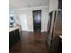 Kitchen with granite countertops, stainless steel refrigerator, and dark hardwood floors at 7406 Purser Ln, Hanahan, SC 29410