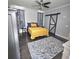 Bedroom featuring a decorative rug, accent wall and modern sliding barn door at 7406 Purser Ln, Hanahan, SC 29410