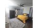 Bedroom featuring a decorative rug, accent wall and modern sliding barn door at 7406 Purser Ln, Hanahan, SC 29410
