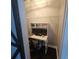 Bright office nook featuring a modern desk, dual monitors, and convenient storage shelves at 7406 Purser Ln, Hanahan, SC 29410