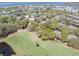 Picturesque aerial view of a golf course community featuring lush greenery, trees, and ponds at 754 Summerwind Cir, Edisto Island, SC 29438