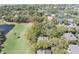 Aerial view of the property nestled among lush trees and close to the golf course at 754 Summerwind Cir, Edisto Island, SC 29438
