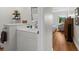 Bright bathroom features a white vanity, hardwood floors and decor shelves at 754 Summerwind Cir, Edisto Island, SC 29438