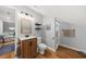 Well-lit bathroom features a wood vanity, hardwood floors, and nautical decor at 754 Summerwind Cir, Edisto Island, SC 29438