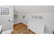Charming bathroom featuring wood floors, coastal-themed decor and white vanity at 754 Summerwind Cir, Edisto Island, SC 29438