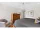 Inviting bedroom featuring hardwood floors, dresser, and comfortable armchair at 754 Summerwind Cir, Edisto Island, SC 29438
