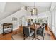 Dining room with modern pendant lighting and views into living area of the home at 754 Summerwind Cir, Edisto Island, SC 29438