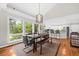 Dining area adjacent to kitchen with hardwood floors and plenty of natural light at 754 Summerwind Cir, Edisto Island, SC 29438