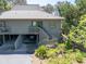 Well-maintained home exterior featuring covered parking, a private balcony and inviting stairs at 754 Summerwind Cir, Edisto Island, SC 29438