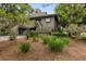 Charming home with covered parking, a balcony, stairs, and beautifully landscaped yard at 754 Summerwind Cir, Edisto Island, SC 29438