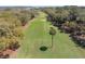 Expansive view of golf course featuring lush greenery, mature trees and palm trees at 754 Summerwind Cir, Edisto Island, SC 29438