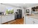 Well-equipped kitchen with stainless steel appliances, a corner sink, and lots of counter space at 754 Summerwind Cir, Edisto Island, SC 29438