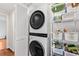Efficient laundry area features stackable washer/dryer and shelving for storage at 754 Summerwind Cir, Edisto Island, SC 29438