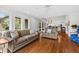 Spacious living room with hardwood floors, natural light, and comfortable seating arrangement at 754 Summerwind Cir, Edisto Island, SC 29438