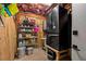 Functional storage room with shelving, utility connections, and a full-sized refrigerator at 754 Summerwind Cir, Edisto Island, SC 29438