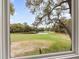 Picturesque view of golf course and pond from the window of this home at 754 Summerwind Cir, Edisto Island, SC 29438