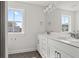 Bathroom with a double sink vanity, quartz countertop, and hexagon tiled floors at 757 Maynard Ln, Summerville, SC 29486