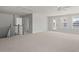 Spacious bonus room with carpet, two doors, windows, and a ceiling fan at 757 Maynard Ln, Summerville, SC 29486
